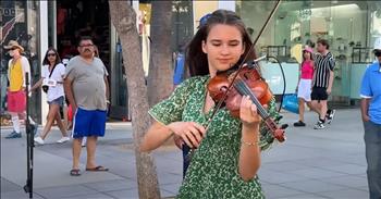 <p>Karolina Protsenko never ceases to amaze us. This young woman is incredibly talented at dancing while she plays her violin. She has such flair, style, and joy. As she performs in the street of a main shopping strip, prepare to be inspired. Check out a teen's fantastic violin cover of Bee Gees' 'More Than A Woman.&rsquo;</p>

<p>Karolina begins by playing on the streets of California in her green dress with her blue bow. The young teen is a talented ballerina and violinist. She knows how to wow an audience with her unexpected twirls and precision of playing. Her precious smile will get you excited too. Karolina plays &lsquo;More Than a Woman&rsquo; with confidence and excitement. She will have you dancing or singing for a long time. In fact, a woman in the audience decides to come nearby and join her in dancing. She gets her groove on unashamedly.</p>

<p>It is fun listening to Karolina play this song about a woman as she herself is growing into a fine young woman. She is poised, collected, and a skilled artist. She stands out because of her unique combination of talents and her wonderfully cheerful demeanor. How has God gifted you? You may not be a dancing violinist, but the Lord has uniquely given you skills. Your personality, your strengths, and your dreams matter to God.&nbsp;</p>

<p>As you watch Karolina motivate a live audience who is shopping, may it remind you that your skills are needed to encourage others as well. You have a purpose in this world and we can all have child-like faith to see the Lord work in mighty ways.</p>

<p><em>&ldquo;There are different kinds of service, but the same Lord. There are different kinds of working, but in all of them and in everyone it is the same God at work.&rdquo; <strong><a href="https://www.godtube.com/bible/1-Corinthians/12-5">1 Corinthians 12:5-6</a></strong></em></p>
