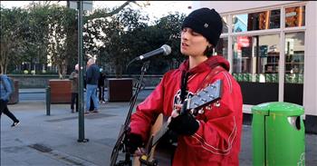 <p>Some voices don&rsquo;t just sing&mdash;they stop time. They weave their way through the everyday chaos, slipping into the cracks of our hearts, demanding to be heard. And that&rsquo;s exactly what happened when Simon Evans, a young man&rsquo;s incredible cover of A-Ha&rsquo;s &lsquo;Take On Me&rsquo; as he stood in the midst of a bustling street, black beanie snug over his head, red jacket catching the light, and started singing.</p>

<p>He wasn&rsquo;t on a stage. He wasn&rsquo;t backed by a full band. He was just there, rooted in the middle of the movement&mdash;people walking by, wrapped up in their own worlds&mdash;until his voice cut through the noise like a songbird piercing through winter&rsquo;s last storm.</p>

<p>At first, it was just another moment on a busy street. Then he opened his mouth.</p>

<p>&ldquo;Talking away&hellip; I don&rsquo;t know what I&rsquo;m to say&hellip; I&rsquo;ll say it anyway&hellip;&rdquo;</p>

<p>Heads turned. Feet slowed. Conversations quieted.</p>

<p>It was the kind of performance that sneaks up on you&mdash;the kind you don&rsquo;t expect, but once you hear it, you can&rsquo;t un-hear it. The richness of his tone, the effortless way he soared through the song&rsquo;s impossible high notes, the quiet confidence in every lyric&mdash;it all worked together to make something holy out of the ordinary.</p>

<p>It wasn&rsquo;t just nostalgia that held the crowd captive. It was the way he sang like he meant it. Like the words had lived inside of him for years, waiting for just this moment to be released into the world.</p>

<p>And when he hit that chorus?</p>

<p>&ldquo;I&rsquo;ll be gone&hellip; in a day or two&hellip;&rdquo;</p>

<p>You could feel it. The weight of the moment, the way his voice wrapped around those notes and sent them straight to the sky. The kind of thing that lingers long after the final chord fades.</p>

<p>It&rsquo;s rare to find a voice that can take a decades-old song and make it feel brand new again, but Simon did just that. There was no big production, no flashing lights&mdash;just raw talent and the kind of presence that makes you stop, listen, and remember that music is meant to be felt.</p>

<p>Because sometimes, joy sounds like a man in a black beanie singing his heart out in the middle of the city, reminding us that music is still magic.</p>

<p><em><strong><a href="https://www.godtube.com/bible/psalms/98-4">Psalm 98:4</a></strong> "Make a joyful noise to the Lord, all the earth; break forth into joyous song and sing praises."</em></p>
