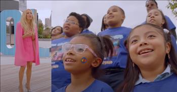 <p>There are moments that take your breath away, moments when everything else fades, and all you&rsquo;re left with is the truth of what truly matters. Carrie Underwood&rsquo;s performance with the PS22 Chorus on &lsquo;American Idol&rsquo; was one of those moments&mdash;an emotional reminder that love is the thing that makes everything else seem small.</p>

<p>As the PS22 Chorus gathered on stage, their choir director, Ryan Seacrest, set the tone with a smile, sharing a piece of their journey. &ldquo;So guys, you know Carrie Underwood sang with the PS22 Chorus. Before you were born, Carrie,&rdquo; he <a href="https://www.youtube.com/watch?v=biqV_p62fpw&amp;ab_channel=AmericanIdol">said</a> with a twinkle in his eye. Ryan, who never misses an opportunity to spark magic, turned to Carrie and asked, &ldquo;Would you join the kids and sing like you did 13 years ago?&rdquo; And Carrie, with her heart wide open, could not help but say yes.&nbsp;</p>

<p>In that instant, the stage came alive&mdash;not with just voices singing a song, but with a message that would stick with you long after the applause faded. As the first notes of &ldquo;So Small&rdquo; filled the air, it became more than just a song. It was a prayer, a declaration that everything we think is too big, too difficult, is often just a grain of sand.</p>

<p>Isn&rsquo;t that the way God works? He gently whispers to us that the burdens we carry aren&rsquo;t as heavy as we think, that what we&rsquo;ve been searching for&mdash;the peace, the joy, the hope&mdash;is already in our hands&mdash;wrapped in His love.</p>

<p>Carrie&rsquo;s voice, so familiar yet so full of grace, harmonized with the PS22 kids, creating something so much bigger than a performance. It was a reminder that when we come together and love and share, the mountains that once seemed impossible to climb suddenly shrink. Love has a way of shifting our perspective.</p>

<p>Isn&rsquo;t that what we need in the daily grind of life? A reminder that, no matter how heavy the burden, love has the power to make everything else feel small. We often find ourselves buried under the weight of our worries, the tasks that never end, the &ldquo;what-ifs&rdquo; that steal our peace. But in this moment&mdash;this sacred, beautiful moment&mdash;we&rsquo;re reminded that love is the key to it all.</p>

<p>Carrie and the PS22 kids gave us a glimpse of what it looks like when love leads when it takes over and turns everything else into something we can overcome. Their voices and hearts came together in a way that transcended any struggle or worry.</p>

<p>So, as we face our own mountains, let&rsquo;s remember: the love we&rsquo;re searching for, the peace we&rsquo;re desperately longing for, is already in our hands. The mountains we face? They're just grains of sand. And love? Love is the thing that makes everything else seem small.</p>

<p><em><strong><a href="https://www.godtube.com/bible/1-corinthians/13-4">1 Corinthians 13:4-7</a></strong> Love is patient, love is kind. It does not envy, it does not boast, it is not proud. It does not dishonor others, it is not self-seeking, it is not easily angered, and it keeps no record of wrongs. Love does not delight in evil but rejoices with the truth. It always protects, always trusts, always hopes, always perseveres.</em></p>
