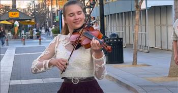 <p>This teen&rsquo;s violin rendition of ABBA's &lsquo;Waterloo&rsquo; wows and amazes, drawing onlookers from a bustling city street. The young lady dazzles as she spins on her violin, playing ABBA&rsquo;s &lsquo;Waterloo.&rsquo; Watch the clip to see how she amazes the crowd with her talents.&nbsp;</p>

<p><a href="https://www.youtube.com/watch?v=j2ghsE3B-j4&amp;list=RDj2ghsE3B-j4">In a clip posted on YouTube</a>, 16-year-old Karolina Protesenko smiles at the camera before she begins her cover of ABBA&rsquo;s &lsquo;Waterloo.&rsquo; She dives in right away, full of energy, twirling and swaying as she plays in the busy street. Many American onlookers soon surround her, watching, clapping, and videoing her performance, and it&rsquo;s easy to see why she&rsquo;s stunned the crowd. The talent she displays is tremendous.&nbsp;</p>

<p>Karolina, who was <a href="https://www.youtube.com/watch?v=j2ghsE3B-j4&amp;list=RDj2ghsE3B-j4">born</a> in Ukraine before moving to America, also attempts other challenging covers on her YouTube <a href="https://www.youtube.com/@KarolinaProtsenkoViolin/featured">channel</a>, with songs like Queen&rsquo;s &lsquo;We Are The Champions,&rsquo; The Beatles&rsquo; &lsquo;Twist and Shout,&rsquo; and Alphaville&rsquo;s &lsquo;Forever Young.&rsquo; At just 16, she has an impressive track record; her cover of &ldquo;Pirates Of The Caribbean&rdquo; has garnered nearly 4 million views.&nbsp;</p>

<p>&lsquo;Waterloo&rsquo; is a daring cover&mdash;it&rsquo;s an unusual song to hear on the violin. The original song, which came out in 1974, <a href="https://www.youtube.com/watch?v=Sj_9CiNkkn4">features</a> upbeat vocals, acoustic and electric guitar, bass, piano, drums, and an array of brass instruments. It has a range of beats that make it hard to keep up with, but Karolina makes it look easy. To hear the pop song on a delicate string instrument like the violin is something pleasantly uncanny to behold.&nbsp;</p>

<p>&ldquo;This song is full of energy and fun, and I loved bringing it to life with my violin 🎶,&rdquo; Karolina <a href="https://www.youtube.com/watch?v=j2ghsE3B-j4&amp;list=RDj2ghsE3B-j4">said</a>. &ldquo;Hope it makes you smile and dance a little today! 😊💃✨&rdquo;</p>

<p>Performing a song like that, which few violinists dare to attempt, is no small feat. Her practice and hard work have turned into a wonderful thing of beauty for us to see and hear. What an inspiration she is!</p>
