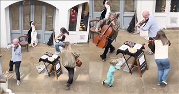 <p>This little boy&rsquo;s surprise appearance with a trio of musicians is too cute to miss. Likely, no one saw the child&rsquo;s absolutely adorable move coming. Watch the short but heartwarming clip to see what the young man did that undoubtedly stole the entire show.</p>

<p>Performers must be able to improvise and be quick on their feet. While hours and hours of preparation go into every public appearance, performers should still be able to roll with changes at a moment&rsquo;s notice. That is especially true when those performers do their thing on the street for the public, with everyone passing by.</p>

<p>Buskers play on the street, hoping to gain an audience and impress many people with their musical skills. Hopefully, their performance will go viral on social media, earning them an even wider audience. Social media is full of musicians singing and performing as they gain widespread attention for their unbelievable gifts and skills. <a href="https://www.youtube.com/shorts/FuY-moqqOWk">One clip on YouTube</a> shows that giving a terrific performance is not the only way to get attention. Sometimes, a little audience participation can help as well.</p>

<p>The video begins with a child enjoying three musicians performing classical music with his grandfather in London. The clip shows the little guy standing by and clapping along with the grandfather as the musicians do their thing. However, moments later, something unexpected happens.</p>

<p>During their public performance, the three musicians started to run around in a circle. Little did they know that they were about to get some audience participation.</p>

<p>Out of nowhere, the child decides he wants to join in on the fun. He approaches the musicians, joins their circle and runs around with them. The musicians go with it, playing right along with their smallest fan.</p>

<p>Several people can be heard laughing at the cute and unexpected display.&nbsp;</p>

<p>What an adorable moment!</p>

<p><em><strong><a href="https://www.godtube.com/bible/proverbs/22-6">Proverbs 22:6</a></strong> &ldquo;If a child is trained up in the right way, even when he is old he will not be turned away from it.&rdquo;</em></p>
