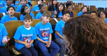 <p>You know how sometimes you're just scrolling&hellip; and then stumble into something that makes the world pause a beat? That happened to me this week, and I have to share it with you. Watch this beautiful video of a Bob Dylan classic, &lsquo;Blowin' In The Wind,&rsquo; as the PS22 Chorus gives it a touching revival.</p>

<p>It was a simple video. A group of kids, all wearing matching blue t-shirts, are sitting in rows in a school auditorium. They were there because they love to sing. They love music and how it changes our emotions, attitudes, and hearts. When their instructor told them they were getting ready to sing this song, there was excitement and a lot of clapping; they couldn&rsquo;t wait!</p>

<p>The PS22 Chorus&mdash;have you heard of them? In case you didn&rsquo;t know, they are a bunch of wide-eyed fifth graders from Staten Island, gathered not for show but for the love of music. And when they opened their mouths and started singing&hellip;friend, it just about undid me.</p>

<p>You could feel it. That still, holy hush before the first lyric. And the joy these bouncy, happy kids could barely contain! Then this happiness&mdash;soft and strong&mdash;lifted the room in harmony.</p>

<p>I watched their sweet faces light up over each line. Their eyes were wide with wonder, like they knew what they were singing mattered. Maybe they couldn&rsquo;t explain it, but somewhere deep in their growing hearts, they felt it: these words have weight. Maybe that&rsquo;s why we all love this classic song so much.&nbsp;</p>

<p>And there it was&mdash;these kids took a dusty classic from decades ago and breathed something holy into it. It was breathtaking to watch, and others online who follow this crew loved it, too.&nbsp;</p>

<p>One commenter <a href="https://www.youtube.com/watch?v=FJ-w8M4qMq0&amp;ab_channel=PS22Chorus">said</a>, &ldquo;The answer is here, in that room.&rdquo;</p>

<p>Yes. That.</p>

<p>That room full of kids reminded me where the answers are.</p>

<p>In innocence. In music. In life. Children who don&rsquo;t overthink words just sing them.</p>

<p>Another person <a href="https://www.youtube.com/watch?v=FJ-w8M4qMq0&amp;ab_channel=PS22Chorus">wrote</a>, &ldquo;Children, you made the day. As I watched while having my coffee and breakfast, my heart was bubbling over with gratitude and love for you and your teachers.&rdquo;</p>

<p>Same here. I felt the same slow bubbling of something sacred. Something like joy. Something like peace.<br />
Something like&mdash;maybe the world isn&rsquo;t as dark as it feels.</p>

<p>So if you&rsquo;ve got a minute, I hope you do&mdash;watch the video.</p>

<p>Let their voices lift you. Let the lyrics remind you. Let your soul settle into that quiet, warm place where hope still sings and the wind still carries answers, even when life&rsquo;s questions feel too heavy.</p>

<p>Maybe today, you just need to be reminded that sometimes God whispers through children. Sometimes, truth comes with a melody. And sometimes the sweetest hallelujahs rise from a school auditorium in Staten Island. Isn&rsquo;t it just like God to wrap glory in something so simple? A few kids. A good song. And a whisper of hope that&rsquo;s been blowing in the wind all along.</p>

<p>Here&rsquo;s the <a href="https://www.youtube.com/watch?v=FJ-w8M4qMq0&amp;ab_channel=PS22Chorus">link to the video</a>.</p>

<p>Watch it. Feel it. Let it carry you.</p>

<p><em>&ldquo;From the lips of children and infants you, Lord, have called forth your praise.&rdquo; &nbsp;<strong><a href="https://www.godtube.com/bible/matthew/21-16">Matthew 21:16</a></strong></em></p>
