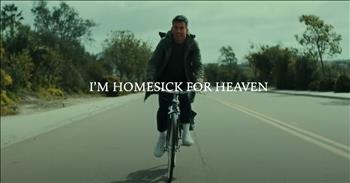 <p>Feeling nostalgic? Then you&rsquo;ll love this new lyric video for Phil Wickham&rsquo;s powerful &lsquo;Homesick for Heaven.&rsquo; There&rsquo;s something about the quiet hum of a long ride that pulls us back into reflection&mdash;back to the winding roads of our lives, the ones we&rsquo;ve walked through joy and sorrow, birth and loss, laughter and waiting.</p>

<p>That&rsquo;s where Phil takes us in his new, amazing video takes us.. It gently whispers our longings&mdash;just like those holy moments we&rsquo;ve lived and loved and buried deep in our hearts.</p>

<p>In the video, Phil sits alone, traveling by bus through America&rsquo;s heartland. You can almost smell the rain on the road. The camera pans over quiet landscapes&mdash;fields brushed with gold, barns weathered with stories, and long stretches of road that feel like prayers. And there he is, quietly watching, reflecting... as if he&rsquo;s listening for the sound of heaven in the stillness.</p>

<p>And then he sings:</p>

<p>&lsquo;My heart belongs to a country and a King,<br />
Of a land I&rsquo;ve always known.&rsquo;</p>

<p>Something about that line catches you in your chest, doesn&rsquo;t it? Because we know what that ache is.<br />
It&rsquo;s the longing we carry after the kids have grown. It&rsquo;s the quiet we sit with after funerals. It&rsquo;s the tears we cry when no one else is watching&mdash;when the world keeps moving but something in us aches for what&rsquo;s eternal.</p>

<p>It&rsquo;s not just nostalgia. It&rsquo;s the soul remembering where it truly belongs.</p>

<p>At this age and stage, we&rsquo;ve seen enough of life to know it&rsquo;s beautiful&mdash;and broken. We&rsquo;ve lost people we didn&rsquo;t want to say goodbye to. We&rsquo;ve held hands tighter than we thought possible. We&rsquo;ve learned that nothing here satisfies the way Jesus does. So when Phil sings about being homesick for heaven, we understand.</p>

<p>This lyric video isn&rsquo;t just a piece of music&mdash;it&rsquo;s an invitation to remember. To remember that we were made for more. To recall that heaven isn&rsquo;t a fairy tale&mdash;it&rsquo;s a forever place. And it&rsquo;s realer than the hard things we&rsquo;ve walked through.</p>

<p>Watching Phil quietly ride and reflect, you begin to feel it too&mdash;that hush of eternity pulling close. That gentle reminder that the aches, the questions, the gray hair, the time slipping through our fingers&mdash;it&rsquo;s all leading us Home. Because the older we get, the more heaven starts to feel like a place we know.</p>

<p>So let the tears come. Let your heart long. Let the song wash over you like a memory you&rsquo;ve almost forgotten&mdash;but not quite. Let your heart long for heaven and let it fill with the joy of what we will feel one day!</p>

<p>Jesus is preparing that place. And one day soon, our hearts will finally be at rest.</p>

<p>Until then, we hold the longing. Because longing means we&rsquo;ve loved deeply. And that love? It leads us home.</p>

<p><em>&ldquo;But our citizenship is in heaven. And we eagerly await a Savior from there, the Lord Jesus Christ.&rdquo; <strong><a href="https://www.godtube.com/bible/philippians/3-20">Philippians 3:20</a></strong></em></p>
