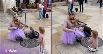 <p>A little one was mesmerized by a woman&rsquo;s stunning violin performance. The child was utterly captivated, unable to take her eyes off the musician as she played the stringed instrument. Watch the short but oh so cute clip to see the youngster&rsquo;s adorable reaction to the musician playing the violin.</p>

<p>Musicians are an incredibly talented group of people. They have been blessed with the ability and gifts to create beautiful, pleasant sounds. And hearing them perform is most certainly a blessing for us because who doesn&rsquo;t enjoy listening to music? Someone who does not like music is almost the same as someone who would claim not to enjoy food; it&rsquo;s completely unheard of.</p>

<p>Many musicians who have spent time working with and growing their musical talent have become extraordinary, creating beautiful works of art. I&rsquo;m sure we could all quickly name musicians we would put in this category. Watching them do their thing and play their instruments with such skill, speed and dexterity can often be a captivating and mesmerizing display. In a <a href="https://www.tiktok.com/@renatagarro.violin/video/7473854705446178070">clip posted on social media</a>, that happened to one young lady as she watched a musician perform the violin.</p>

<p>In the clip, a musician is outside in a busy city square playing a violin for all who walk by to hear. However, seconds into the clip, someone is completely enchanted by the young woman&rsquo;s performance. A little girl sits on the ground inches away from the violinist and takes in the performance. She does not want to miss a moment of this stunning musical display.</p>

<p>About halfway through the clip, the youngster feels compelled to get up and dance to the beautiful sounds she hears. She stands up and starts moving in circles while excitedly flailing her arms. She is in a state of complete happiness and joy.</p>

<p>After the violin performance, it&rsquo;s the youngster who leads the applause and cheers for the musician.</p>

<p><em><strong><a href="https://www.godtube.com/bible/colossians/3-16">Colossians 3:16</a></strong> &ldquo;Let the word of Christ dwell in you richly in all wisdom; teaching and admonishing one another in psalms and hymns and spiritual songs, singing with grace in your hearts to the Lord.&rdquo;</em></p>
