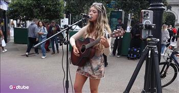 <p>There&rsquo;s something about music drifting through an open-air square that can pull you right out of your day and plant you in a moment you didn&rsquo;t know you needed. This busker&rsquo;s beautiful cover of the Beatles&rsquo; classic &lsquo;Let It Be&rsquo; will make your day.</p>

<p>In the heart of Dublin&rsquo;s bustling city center&mdash;where footsteps scatter like rain and conversations weave in the air&mdash;Kyla Belle stands with her dark brown guitar cradled close. Her long blond hair catches the Irish breeze, moving like the rhythm of the song she&rsquo;s about to sing.</p>

<p>She begins to strum the familiar opening chords of one of our all-time favorite Beatles classics, Let It Be. And that&rsquo;s when the world, for just a breath, seems to hush.</p>

<p>It&rsquo;s not just the song, it&rsquo;s the way Kyla sings it. Her sultry, whispery voice curls around the words with the kind of warmth that feels like it&rsquo;s been steeped in heartache and hope. There&rsquo;s a hint of Stevie Nicks in her tone, that smoky magic that makes you lean in closer, listen harder.</p>

<p>Anyone trying to carve their place in the music world knows the secret: take a song people love, and make it wholly your own. But the ones who really make you stop, those rare voices, they pour their soul into it.</p>

<p>That&rsquo;s what Kyla does. She doesn&rsquo;t belt it; she breathes it. Every note is a soft and stunning twist, reminding you that Let It Be is a prayer. A surrender. A comfort all in one song.&nbsp;</p>

<p>And in that busy Dublin square, surrounded by strangers who were just passing through, her music becomes a bridge. One that connects us&mdash;whether we&rsquo;re locals, tourists, or just weary souls who need a reminder that beauty is still alive in the world.</p>

<p>Sometimes, all it takes to change a day is the right song, sung by the right voice, and at just the right moment. And when you hear Kyla sing, you can&rsquo;t help but listen.</p>

<p><em>&ldquo;Be still, and know that I am God.&rdquo; <strong><a href="https://www.godtube.com/bible/psalms/46-10">Psalm 46:10</a></strong></em></p>
