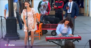 <p>A teen delivers a beautiful cover of &lsquo;Bridge Over Troubled Water&rsquo; in a crowded street, and passersby are stunned. Karolina Protsenko&rsquo;s cover is absolutely beautiful. Play the video to hear it.&nbsp;</p>

<p>The 16-year-old, known for her proficient violin skills, traded her instrument for a microphone for this cover. She shares lots of covers on her YouTube channels, and her violin cover of &ldquo;Pirates Of The Caribbean&rdquo; has garnered nearly 4 million views. It turns out she&rsquo;s just as talented at singing as she is at playing the violin.&nbsp;</p>

<p>The young girl was <a href="https://www.youtube.com/watch?v=j2ghsE3B-j4&amp;list=RDj2ghsE3B-j4">born</a> in Ukraine before moving to America. Some of her other violin covers are Queen&rsquo;s &lsquo;We Are The Champions,&rsquo; The Beatles&rsquo; &lsquo;Twist and Shout,&rsquo; and Alphaville&rsquo;s &lsquo;Forever Young.&rsquo; Some of her other voice <a href="https://www.youtube.com/@KarolinaRoseOfficial/videos">covers</a> are &lsquo;What Was I Made For,&rsquo; &lsquo;Stand By Me,&rsquo; and &lsquo;Put Your Records On.&rsquo; &nbsp;Her parents and little brother also occasionally perform with her.&nbsp;</p>

<p>Karolina&rsquo;s mother, Ella Protsenko, accompanies her on the piano as she sings &lsquo;Bridge Over Troubled Water.&rsquo; As Karolina sang the words, many people stopped to hear her voice. A little girl and an old woman even danced in front of her as she sang, which is an excellent compliment to any singer.&nbsp;</p>

<p>Some of the words from the song, &lsquo;Bridge Over Troubled Water,&rsquo; are:</p>

<p>I'm on your side. When times get rough<br />
And friends just can't be found,<br />
Like a bridge over troubled water<br />
I will lay me down.</p>

<p>It&rsquo;s a beautiful song about selflessness and support for loved ones. The word imagery is even more powerful than &ldquo;a shoulder to lean on.&rdquo; It implies that there is nothing more important than being there for a friend or loved one.&nbsp;</p>

<p>It&rsquo;s easy to see that Karolina is tremendously talented and has a bright future in the music space. After you listen to this cover, you&rsquo;ll return to it to hear it again.</p>
