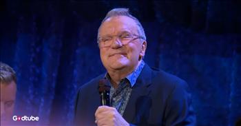 <p>Check out this joyous rendition of the song &lsquo;Leaning on the Everlasting Arms.&rsquo; Mark Lowry leads the group, and the singers have such joy on their faces while they sing out the lyrics. We hope this wonderful version of this classic hymn uplifts you today!</p>

<p>&lsquo;What a fellowship, what a joy divine<br />
Leaning on the everlasting arms<br />
What a blessedness, what a peace is mine<br />
Leaning on the everlasting arms&rsquo;</p>

<p>This popular gospel hymn, &lsquo;Leaning on the Everlasting Arms,&rsquo; was written by two authors. Elisha A. Hoffman, who composed more than 2,000 compositions and compiled nearly 50 songbooks and hymnals, wrote the stanzas. Anthony J. Showalter wrote the refrain, as well as the music. The song was first published in 1887 in the Glad Evangel for Revival, Camp and Evangelistic Meeting Hymnal.</p>

<p>The beautiful hymn references Deuteronomy 33:27, which says, "The eternal God is your refuge, and underneath are the everlasting arms." What a great reminder that our relationship with Jesus can be an intimate one, and we can see him as a friend that we can rely on and lean on.&nbsp;</p>

<p>When it comes to Mark Lowry and his background, he is best known for co-writing the song &lsquo;Mary, Did You Know?&rsquo; and being a member of the Gaither Vocal Band from 1988 to 2001, and 2009 to 2013, along with Michael English, Guy Penrod, David Phelps, and Bill Gaither.</p>

<p>Mark Lowry, along with the other singers in this video, did a wonderful singing of &lsquo;Leaning on the Everlasting Arms.&rsquo; This is the type of song that reminds people about the peace found through the grace and refuge of God. In the grace of the Father&rsquo;s everlasting arms, we can truly find joy, peace, and nearness to Him. May you be encouraged today as you listen to this beautiful rendition.</p>

