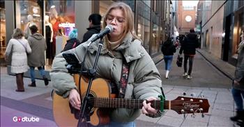 <p>This young woman&rsquo;s beautiful rendition of Adele&rsquo;s &ldquo;Someone Like You&rdquo; wows and stuns. It is simply astounding. Watch the video to see her endless talent.</p>

<p>When artist Zoe Clark picks up that guitar, you don&rsquo;t know what to expect. Her performance is nothing short of amazing. As she stands on a busy Dublin street, passersby slowly take in her voice.&nbsp;</p>

<p>She appears relaxed and lazily in tune with the music and takes Adele&rsquo;s song and spins it into something that&rsquo;s her own. It is more raw and stripped down. It sounds as if she fully grasps the pain in the lyrics:&nbsp;</p>

<p>"Don't forget me, " I beg<br />
I remember you said<br />
"Sometimes it lasts in love, but sometimes it hurts instead"<br />
"Sometimes it lasts in love, but sometimes it hurts instead"</p>

<p>The guitar playing is clear and as pretty as her voice. Around her, the skies and street look gloomy and cold, but her voice brings pleasant warmth. When she plays, she&rsquo;s in the zone.&nbsp;</p>

<p>She is completely unbothered by the busy bustle around her as she just slips into her music. She&rsquo;s completely locked into the emotion of the moment. Zoe sings as though she&rsquo;s singing the song to someone, delivering lyrics from her soul.&nbsp;</p>

<p>You almost have to wonder if she&rsquo;s had an experience that relates to the song. It is certain that nothing about her art is flashy in any way, but it is completely beautiful and show-stopping nonetheless. She is the opposite of dramatic; she is sincere. And it is simply impossible not to notice her talent.&nbsp;</p>

<p>All in all, this is one of those striking performances that sticks in your heart long after you&rsquo;ve heard it. It brims with genuine, heartfelt emotion. So, if you find that this song has stopped you in your tracks and struck a chord in you, then just let it.</p>
