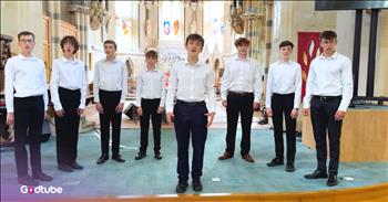 <p>There is something powerful about an a acapella song. When young men come together and pull this off, it is truly inspiring. You&rsquo;ll get chills hearing this boy's choir sing &lsquo;Nearer, My God to Thee.&rsquo;</p>

<p>A group of young men, dressed in white shirts and black slacks, stand in a semi-circle in front of a stunning church. They appear to be no older than eighteen, and the youngest is very mature for his age. What they accomplish is magnificent.&nbsp;</p>

<p>The group begins together, with tight harmonies filling the acoustics of the church. Suddenly, a soloist steps up to the front. He has a fantastic and smooth voice; you will instantly love hearing him lead.&nbsp;</p>

<p>He is easy to listen to, and the background vocals are incredibly done. They have beautiful tone painting and dynamics in their group. As the lead singer hits the high notes, you will be amazed at how his voice soars.&nbsp;</p>

<p>In an unexpected turn, the youngest singer steps forward as the lead vocalist steps back on a powerful bridge. The transition from singers is unexpected, yet so naturally done. This young boy has such a wonderful vocal ability for his age.&nbsp;</p>

<p>It will wow you. It will leave you wanting to hear more. Their tight-knit vocals, high energy, and positive attitudes of teamwork provide such encouragement to anyone listening and viewing.&nbsp;</p>

<p>The lyrics to this timeless hymn say:</p>

<p>Nearer, my God, to thee, nearer to thee!<br />
E'en though it be a cross that raiseth me,<br />
still all my song shall be,</p>

<p>As you reflect on God&rsquo;s closeness to all of us and His promises of His presence for all who accept Jesus as Savior, rejoice. Ponder the importance of these lyrics out of the mouths of these boys. God is near to us, and we can hold on to this promise and hope in Him.&nbsp;</p>

<p><em>&ldquo;Behold, how good and pleasant it is when brothers dwell in unity!" <strong><a href="https://www.godtube.com/bible/Psalms/133-1">Psalm 133:1</a></strong></em></p>
