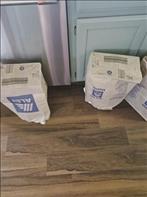 Samuel L Catson and Christopher Donut, two bottle raised rescue kittens, battle it out in paper bags while mom tries to put away groceries. Typical orange cat behavior. Credit: Brandi Ebbs