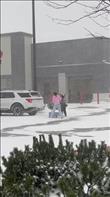 My 15-year-old daughter saw someone struggling to push her shopping cart through the ice and snow in the parking lot and started walking over to help. I started recording when I noticed her walking in that direction. Afterwards, she offered to help her load her items into her car, but she said no thank you and thanked my daughter for helping. Credit: Kerri Jolicoeur