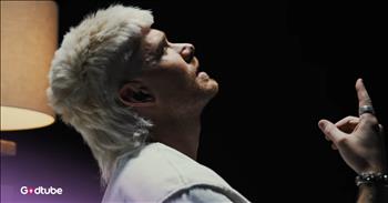 <p>Get inspired! See as Colton Dixon drops his official music video for &lsquo;The Love I Have For You.&rsquo;</p>

<p>The beginning of this video will immediately spark your interest with the artistry and creativity. At the start of the clip, Colton is seen in a mirror image on his bed, waking up in a dark room. He begins to sing about anxiety, a struggle that so many people can relate to who are watching. Colton appears &ldquo;stuck in bed&rdquo; with his mental health; however, then you get to the chorus, and he is empowered by the love that Jesus has for him.</p>

<p>The chorus sings out:</p>

<p>With the love I have for you<br />
Ain't a mountain you can't move<br />
In the dark, I'll be the light<br />
In the fight, I'm by your side</p>

<p>This song is one that you will want to hear in the car, working out, or to pump you up in the morning. Colton bears his heart in the real battle with mental health and spiritual warfare that the enemy brings into the lives of believers. If you or someone you know is feeling stuck in a pit, this song will motivate you not to give up, because the love of Jesus will help you walk through the darkest valleys into victory.</p>

<p>At the bridge, Colton multiplies and dances in his red jumpsuit. The look in his eyes tells it all. He is vulnerable and confident in the power of the Holy Spirit.&nbsp;</p>

<p>The world needs brave people sharing the testimonies of their hardships and how Jesus has pulled them out of rough places and walked with them into His peace. You will love Colton&rsquo;s take on the love of Jesus.</p>

<p><em>&ldquo;There is no fear in love. But perfect love drives out fear, because fear has to do with punishment. The one who fears is not made perfect in love." <strong><a href="https://www.godtube.com/bible/1-John/4-18">1 John 4:18</a></strong></em></p>
