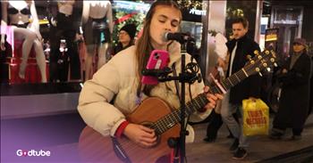 <p>A young busker belts out a powerful rendition of U2&rsquo;s &ldquo;With or Without You&rdquo; on a busy Dublin street corner, and it is incredibly striking. It is simply beautiful and breathtaking. Play the video to listen.&nbsp;</p>

<p>The busker is 14-year-old Bella Shields. People can&rsquo;t help but notice her as they walk by. Her voice is gentle yet striking, piercing your soul.</p>

<p>It&rsquo;s an interesting moment on the busy street. People are preoccupied with shopping and errands, but Bella&rsquo;s voice cuts through it all, offering something ethereal amid the tangible hustle and bustle. Her lovely acoustic strums add to the beauty of it all.&nbsp;</p>

<p>The song contrasts so much with the setting. It creates a pocket of wonder in peace. It makes the material things that surround her, including a Victoria&rsquo;s Secret store, completely meaningless. The lyrics highlight humanity and the push-and-pull of relationships.&nbsp;</p>

<p>Some of the lyrics to &ldquo;With or Without You&rdquo; are:&nbsp;</p>

<p>I can't live<br />
With or without you<br />
And you give yourself away<br />
And you give yourself away</p>

<p>Bella&rsquo;s style is very peaceful and laid back, which makes it so easy to slip into her music. What makes her performance really impressive is her age. At a mere 14, she sings with great emotional depth and maturity that&rsquo;s unexpected.&nbsp;</p>

<p>She&rsquo;s sincere and lets the song speak for itself, standing calm as everything else moves around her. She turns an ordinary street and evening into an intimate, unforgettable moment&mdash;and doesn&rsquo;t seem to know of the magic she creates.&nbsp;</p>

<p>All in all, her performance brought a special bubble of wonder to that busy street. It feels raw and deeply human.&nbsp;</p>

<p>And after the song ends, you find yourself wanting to keep hearing the young girl&rsquo;s beautiful, velvety voice. Her song is over far too soon.</p>
