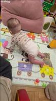 At six months old, the baby reaches the bar. Credit: tkachavikaa