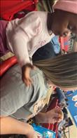 We are at a basketball game at Jonesboro Hodge High School gym. The lady with the skittles always shares with the baby. This is their encounter at every game. Credit: Mattie Ann