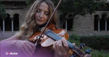<p>This is an incredibly beautiful, moving violin take on Christina Perri&rsquo;s &ldquo;A Thousand Years.&rdquo; It is just stunning. Play the video to enjoy its serene quality.</p>

<p>Zhanna Stelmakh is an incredibly talented young woman. Her beautiful violin playing is special all on its own, but when it's combined with these stunning visuals, like in this video, it is astounding.&nbsp;</p>

<p>The Germany-based musician plays in the courtyard of an old, but well-kept stone building near the sea. It&rsquo;s so serene and peaceful to look at the wonderful scenery from aerial and close-up views while she plays her music. It&rsquo;s a wonderful mix of beautiful architecture and nature.&nbsp;</p>

<p>This isn&rsquo;t a simple song to capture on the violin, but Zhanna does it so well. She&rsquo;s an absolute master and is a joy to watch.&nbsp;</p>

<p>If you want a few words to sing along with the beautiful track, some of &ldquo;A Thousand Years&rdquo; lyrics are:&nbsp;</p>

<p>And all along I believed I would find you<br />
Time has brought your heart to me<br />
I have loved you for a thousand years<br />
I'll love you for a thousand more</p>

<p>Christina Perri wrote the song in 2011 with her producer, David Hodges, specifically for the movie &ldquo;The Twilight Saga: Breaking Dawn&ndash;Part 1.&rdquo; After it played in the credits, the producers wanted it to be in Part 2, too.</p>

<p>Christina <a href="https://www.teenvogue.com/story/christina-perri-twilight">said</a>, &ldquo; I received a phone call that during a screening for Breaking Dawn &ndash; Part 2, they put in 'A Thousand Years' as a temp, and they had planned to use a new song. But when they watched it together, they said, 'this is it.' I was asked if I minded recording it again, and I said, 'no!'&rdquo;</p>

<p>&ldquo;I got to re-do it with a full orchestra, and I made it a duet and added a verse,&rdquo; she <a href="https://www.teenvogue.com/story/christina-perri-twilight">said</a>. I'm super honored.&rdquo;</p>

<p>It&rsquo;s a beautiful love song that resonates with many more than just &ldquo;Twilight&rdquo; fans. Anyone who enjoys good music loves its melody, and Zhanna does a wonderful job of honoring the song's beauty.</p>
