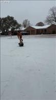 We used a laundry basket as a sled. My husband is pushing my son in the basket on the ice.
