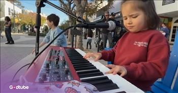 <p>Check out this sweet video of a child singing &ldquo;Knockin&rsquo; on Heaven&rsquo;s Door&rdquo; with his family. This tender rendition of this Bob Dylan classic is from one talented 4-year-old boy named Nicholas Protsenko. He is bringing joy to the streets with his heartfelt performance, and his voice, full of sincerity and innocence, moved everyone around him.</p>

<p>&lsquo;Mama, take this badge off of me<br />
I can&rsquo;t use it anymore<br />
It&rsquo;s getting dark, too dark to see<br />
I feel I&rsquo;m knockin' on heaven&rsquo;s door&rsquo;</p>

<h2>Music Can Bring People Together&nbsp;</h2>

<p>What a great performance! This child singing &ldquo;Knockin&rsquo; on Heaven&rsquo;s Door&rdquo; has such pure emotion, and seeing his sister join him on the violin right from the beginning creates a beautiful, powerful duet. People all around them stop, smile, and simply enjoy the sweet moment in front of them. No matter the age, music is one thing that can bring people together.</p>

<p>Nicholas is part of the talented Protsenko family, where everyone has a deep love for one another and music. Karolina, the oldest of her siblings, is a talented young musician who plays violin, sings, and also loves to read and bake. Leo is known to pick up any instrument and sing along whenever he hears music. He&rsquo;s also very good at playing piano. Nicholas, the youngest of the bunch, also plays piano and uses his voice to add music to the family.</p>

<p>As for the song "Knockin' on Heaven's Door," Bob Dylan wrote it for the soundtrack of the 1973 film Pat Garrett and Billy the Kid. It was released as a single two months after the film's premiere and became a worldwide hit, reaching the Top 10 in several countries. The song became one of Bob Dylan's most popular and most performed post-1960s songs.</p>

<p>We hope you enjoyed watching this rendition from young Nicholas Protsenko of Bob Dylan&rsquo;s "Knockin' on Heaven's Door" today.</p>
