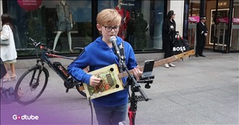 <p>This young busker&rsquo;s cover performance gets a twist with a very unique instrument. The 12-year-old boy, Riordon Hopwood, strums and sings on a three-string cigar box guitar his father made. It&rsquo;s a very special performance that&rsquo;s fun to watch. Play the video to see young Riordian take it away.</p>

<p>If you don&rsquo;t already stop in your tracks for talented buskers, you&rsquo;ve got to at least stop when you see one so young and talented like Riordan. He&rsquo;s only 12, but he&rsquo;s got classic taste&mdash;he sings &ldquo;Money (That&rsquo;s What I Want)" by The Beatles.&nbsp;</p>

<p>Some of the <a href="https://genius.com/The-beatles-money-thats-what-i-want-lyrics">lyrics</a> from the classic hit are:&nbsp;</p>

<p>Well, now, give me money (That's what I want)<br />
Whole lot of money (That's what I want)<br />
Woah, yeah, you know I need money (That's what I want)<br />
Oh, now, give me money, yeah (That's what I want)</p>

<p>The lyrics are certainly not deep, and they are quite repetitive, but people like the Beatles&rsquo; song because everyone can easily relate to it. Who hasn&rsquo;t wanted a little cash one time or another? Plus, it is quite catchy.&nbsp;</p>

<h2>This Young Busker is Going Places&nbsp;</h2>

<p>The young boy&rsquo;s unique instrument performance makes quite the impression on passersby.&nbsp;<br />
Riordan is well on his way to a bright musical career. The 12-year-old is a hard worker with a dream of performing beyond Dublin&rsquo;s streets. Riordan is an inspiration to other young kids. If he can do something like this, then they can, too.&nbsp;</p>

<p>He <a href="https://www.youtube.com/watch?v=RGnsmmItTKM">says</a>, &ldquo;I practice every day and perform every single week, whether on Grafton street, open mics, or in the school band/choir with my classmates. Like my hero Ed Sheeran, I believe hard work, hustle, and heart are what shape an artist. Every gig, every cover, every crowd teaches me something new.&rdquo;</p>

<p>Busking can be hard. Some crowds are tough, while others are captivated. Hopefully, Riordan will stick to that determination and keep on busking and offering more unique instrument performances!</p>

<p><strong>YOU MAY ALSO LIKE: <a href="https://www.godtube.com/watch/?v=GGDWPWNX">Busker's Fantastic Cover of Kenny Rogers' 'The Gambler'</a></strong></p>
