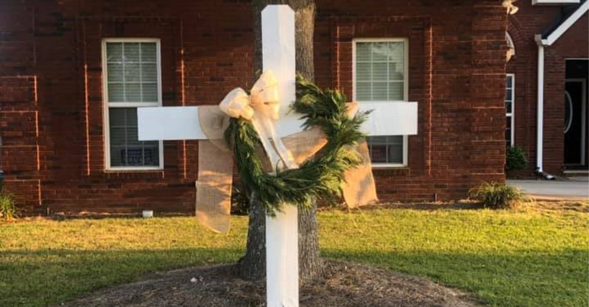 Homemade crosses appear in front yards to encourage 'faith over