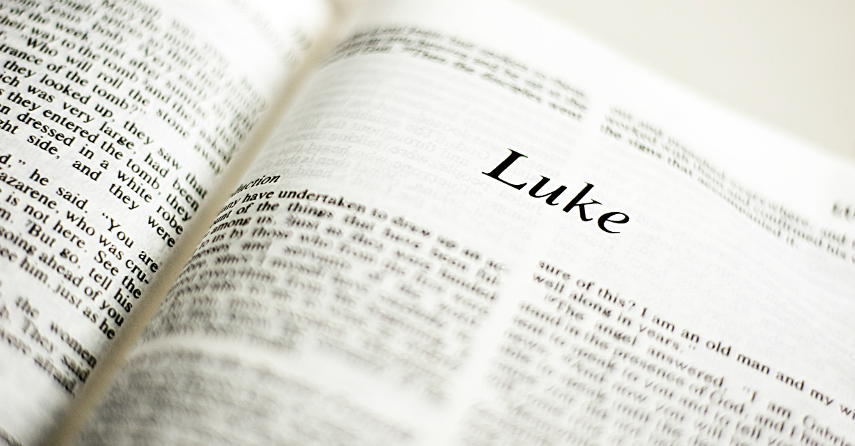 Bible opened to the book of Luke, parable of the Good Samaritan