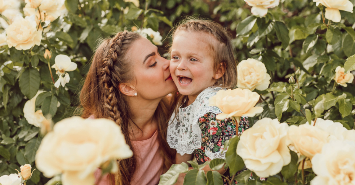 Mom and daughter in a field of flowers