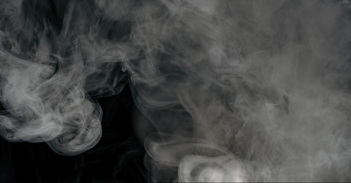 Billow of white smoke with a black background