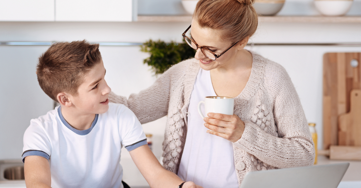 mom and child talking in kitchen