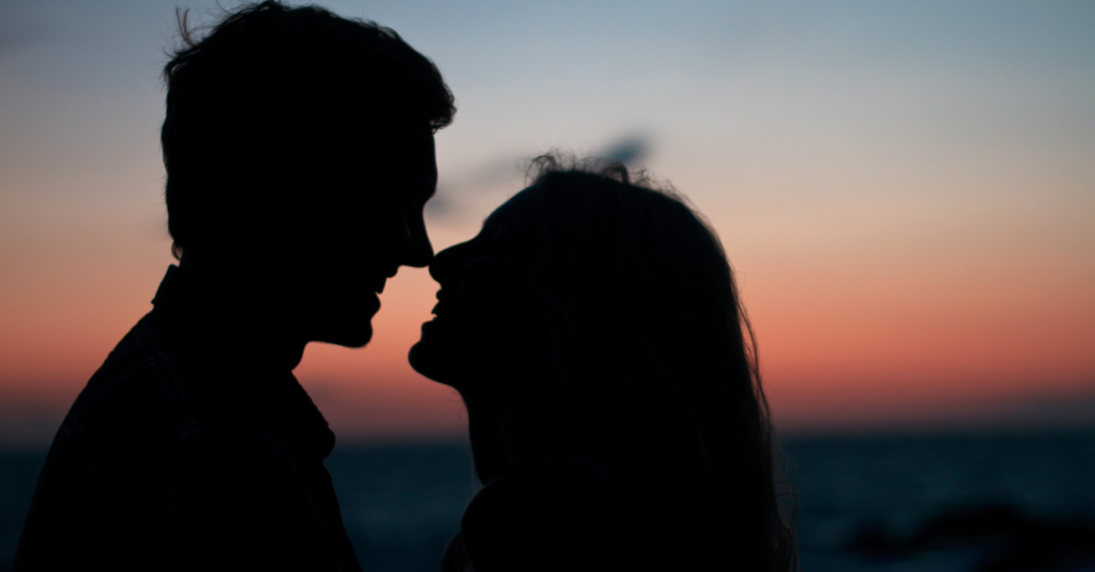 A couple at sunset, abstaining from everything during the pandemic except sex