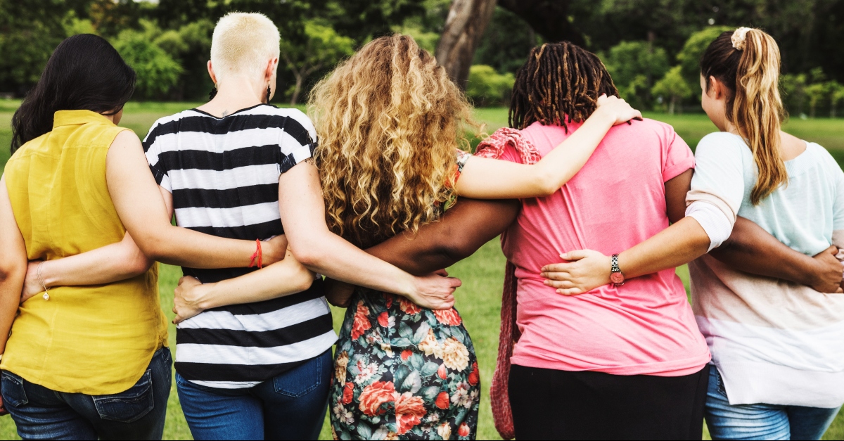 Group of women linked arms