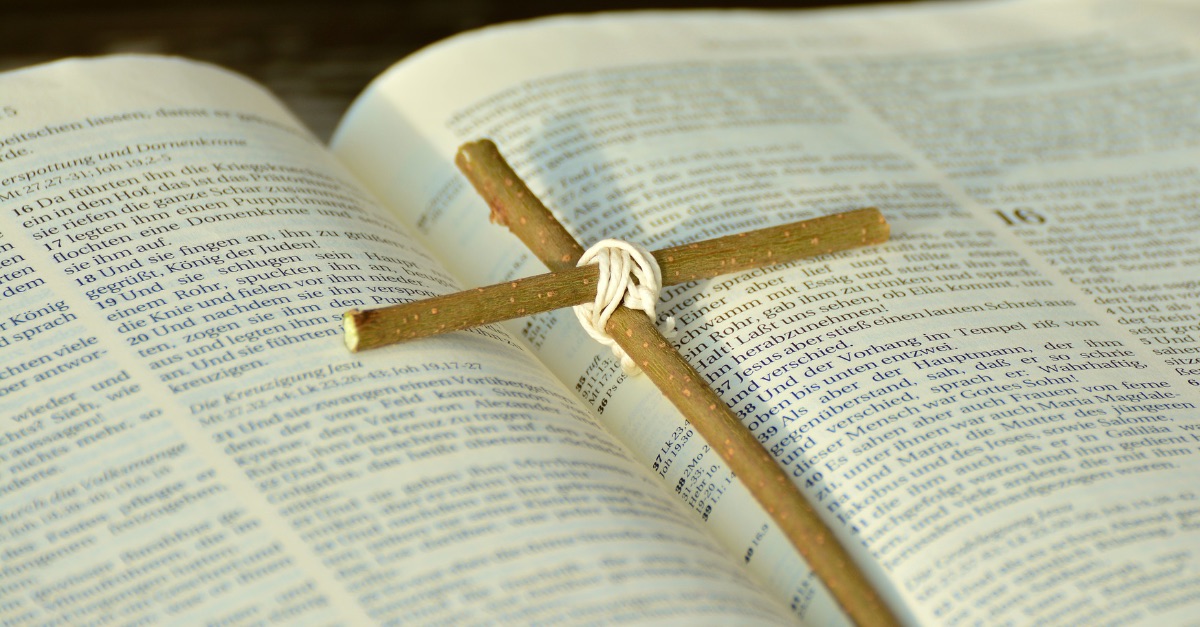 the Bible with a cross