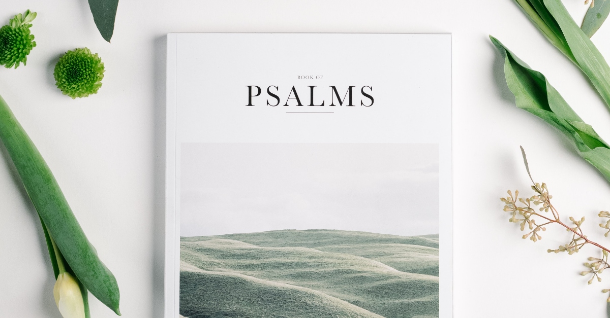 Book of Psalms surrounded by flowers, enter his gates with thanksgiving
