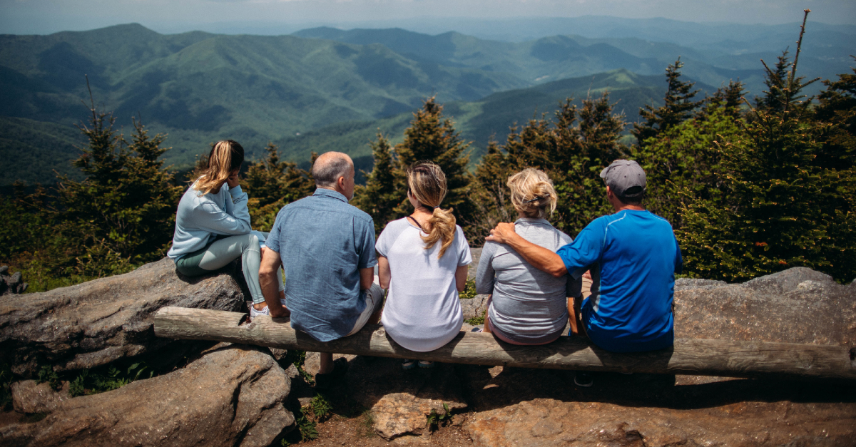 family at base of mountain