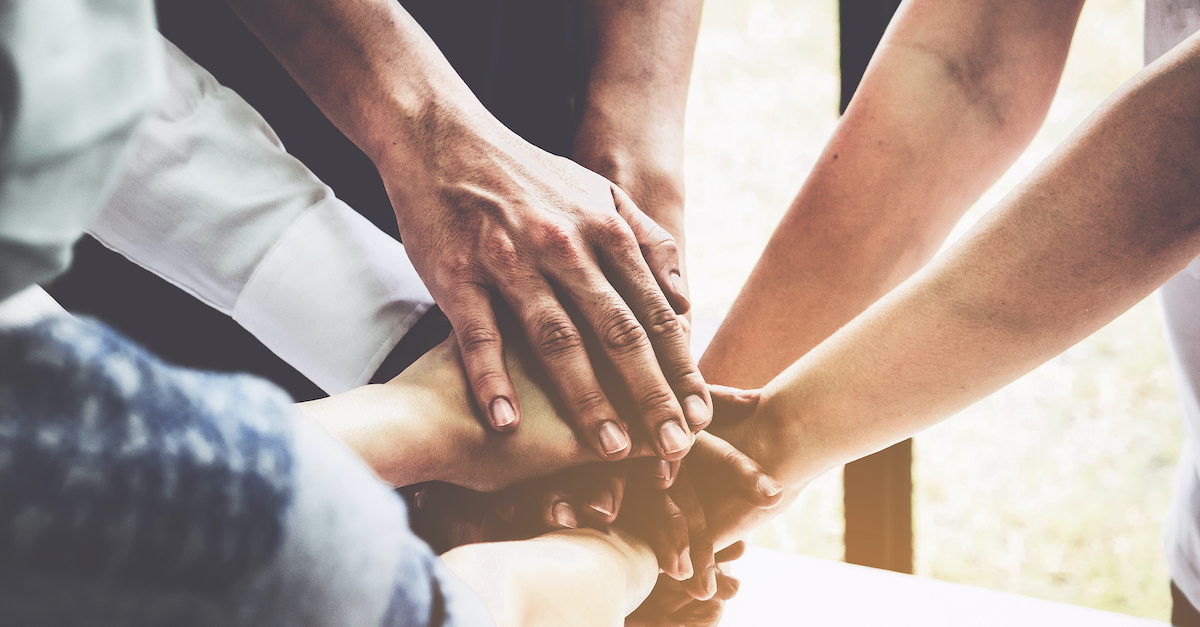 praying hands in a pile of unity, prayers for justice