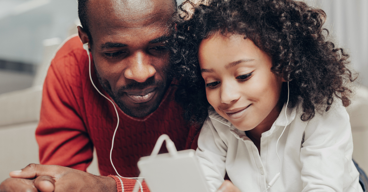 dad and kid listening to music