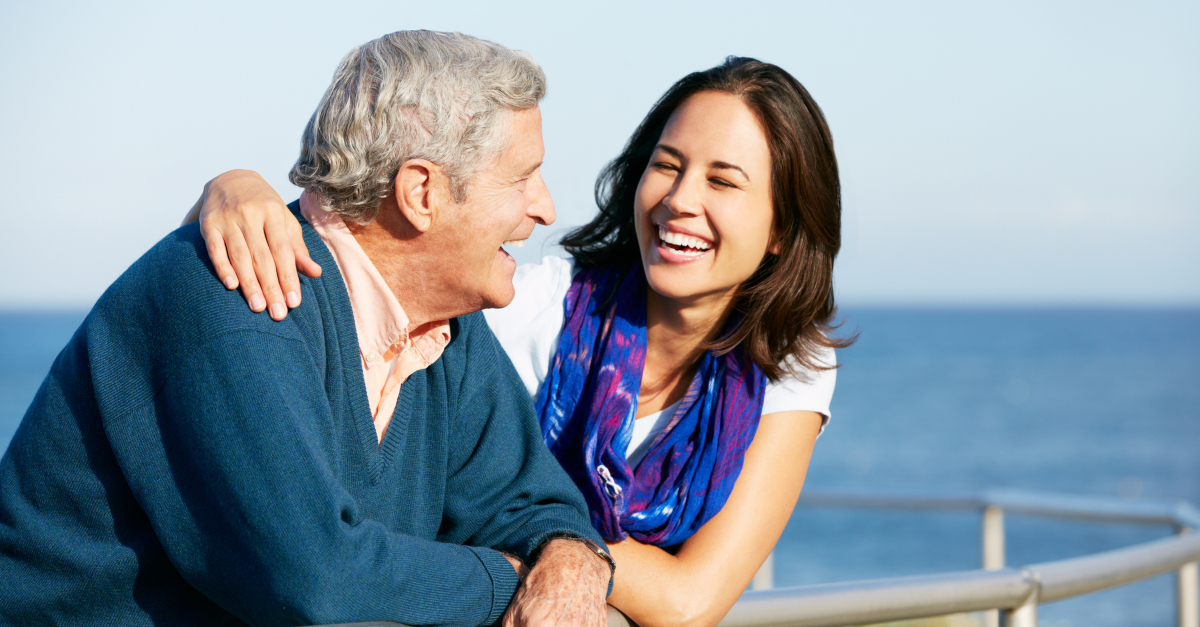 adult woman hugging dad at beach, adult children asking for friendship