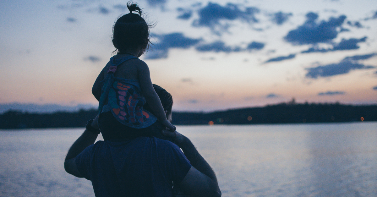 dad with daughter at sunset