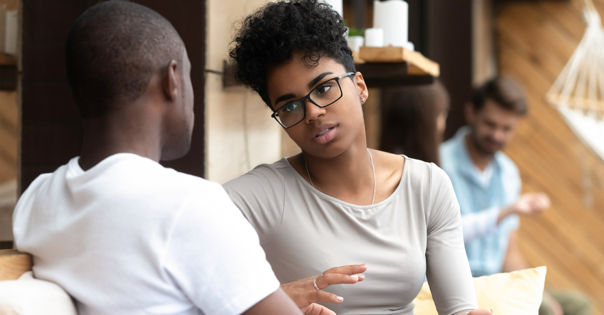 couple in a serious conversation, loving someone when they're angry