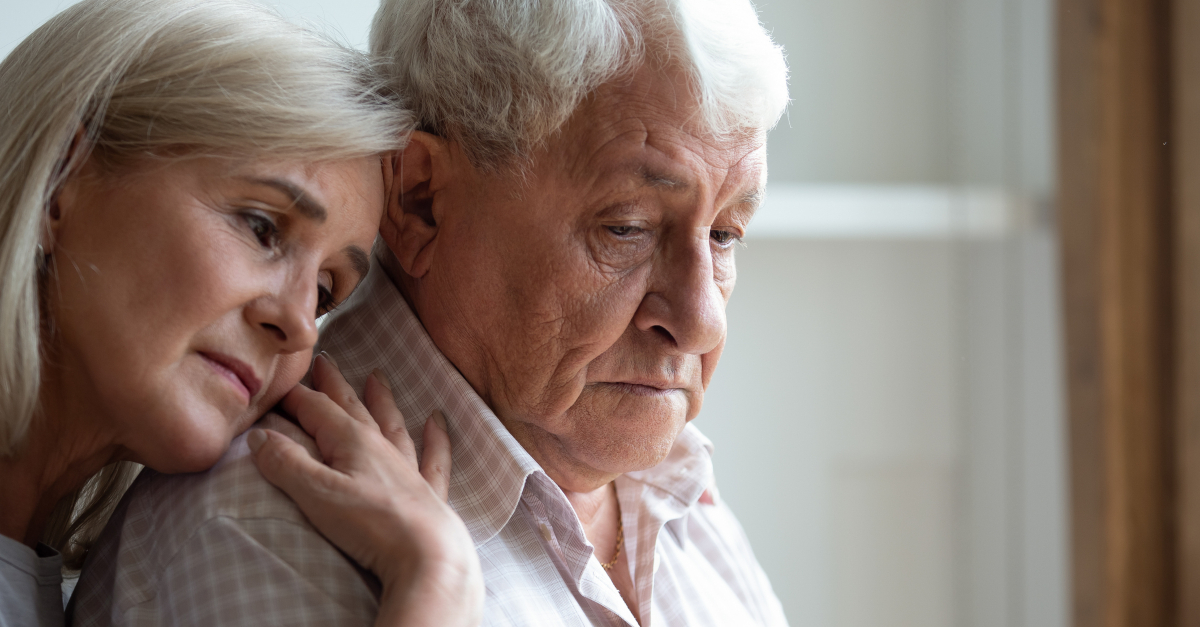 senior daughter hugging elderly dad father