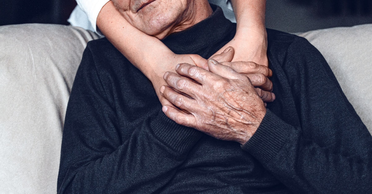 grandchild hugging grandfather from behind, prayer for grandparent's heart during quarantine