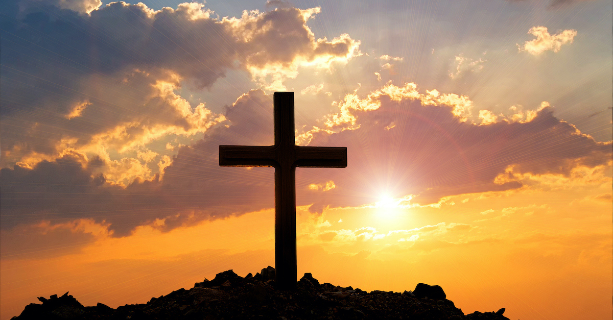 silhouette of cross against sunset background, God provides