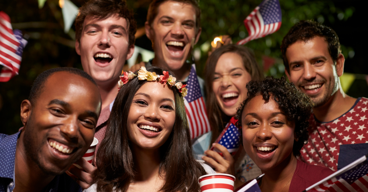diverse multicultural friends gathering for fourth of july celebration