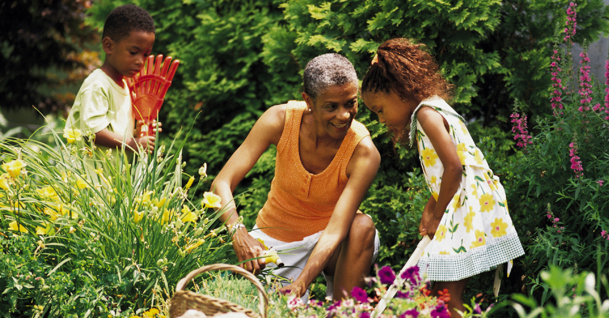 grandma gardening with grandkids outside