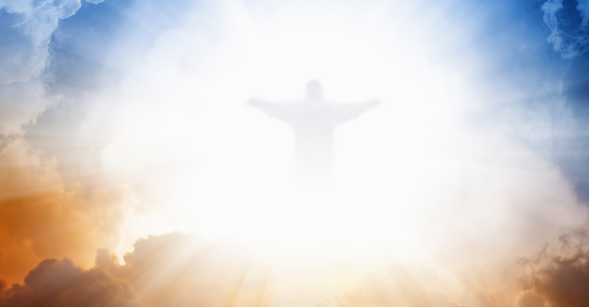 image of Jesus Christ bursting through blue and orange sky Son of God