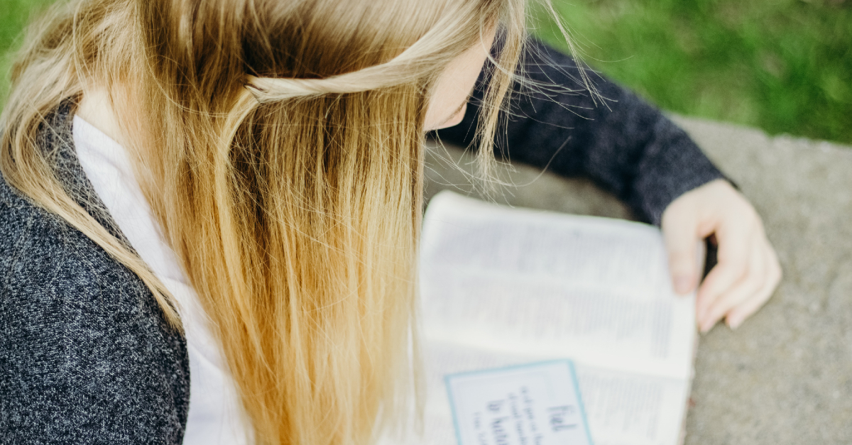 teen girl reading the bible