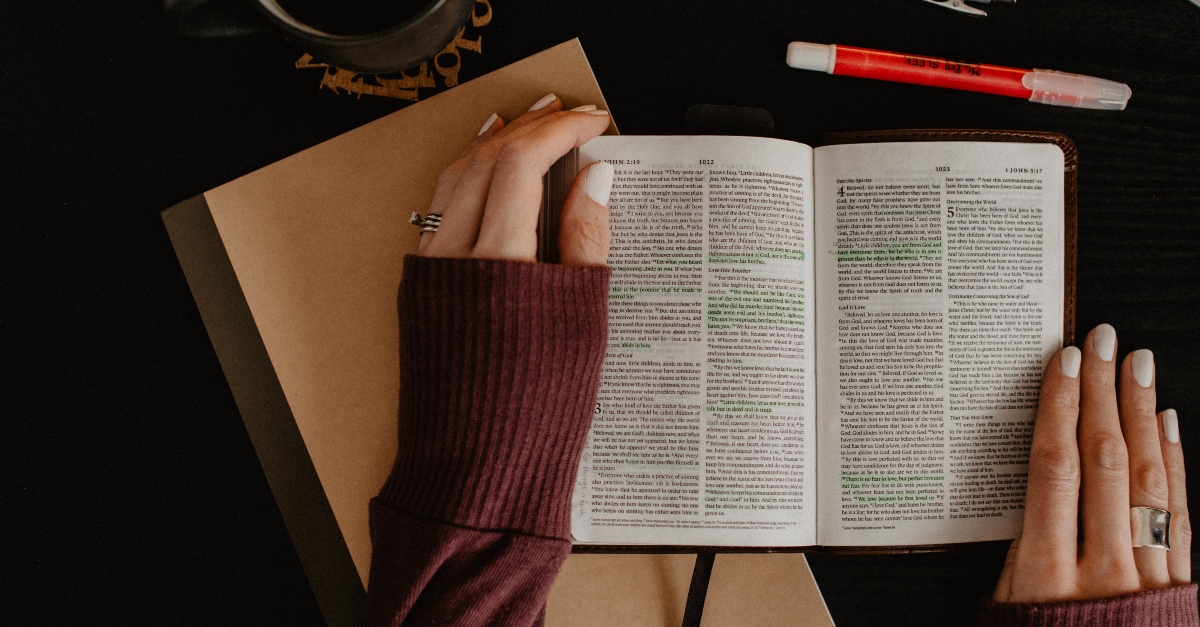 woman studying and reading bible, how to dive deeper into scripture