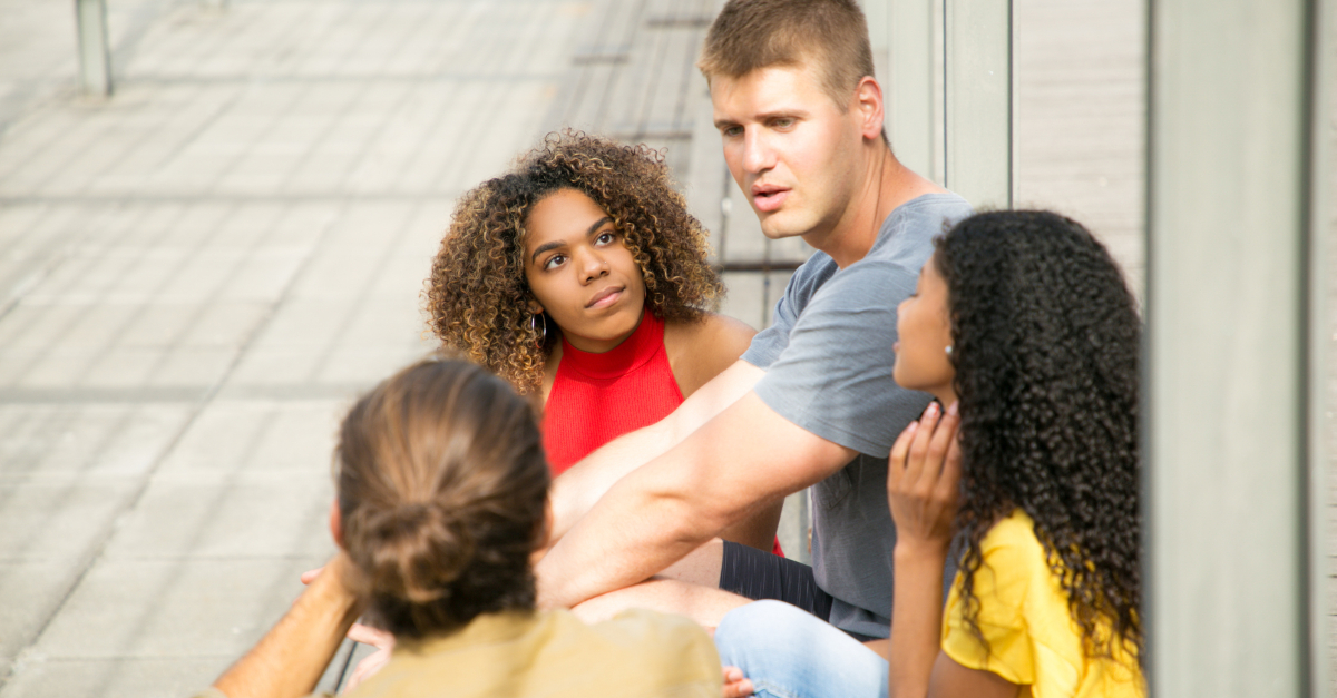 group of friends having serious discussion conversation