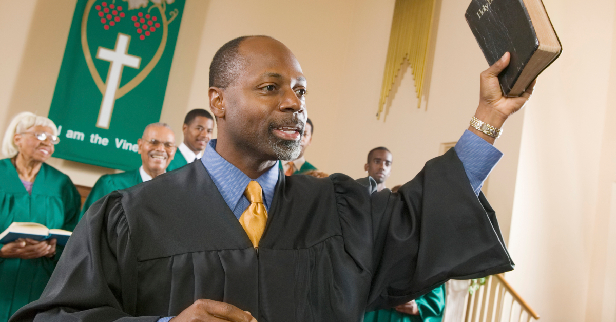 preacher with Bible preaching to the choir