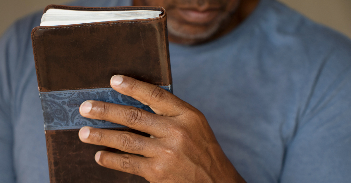 closeup of bible in man's hand