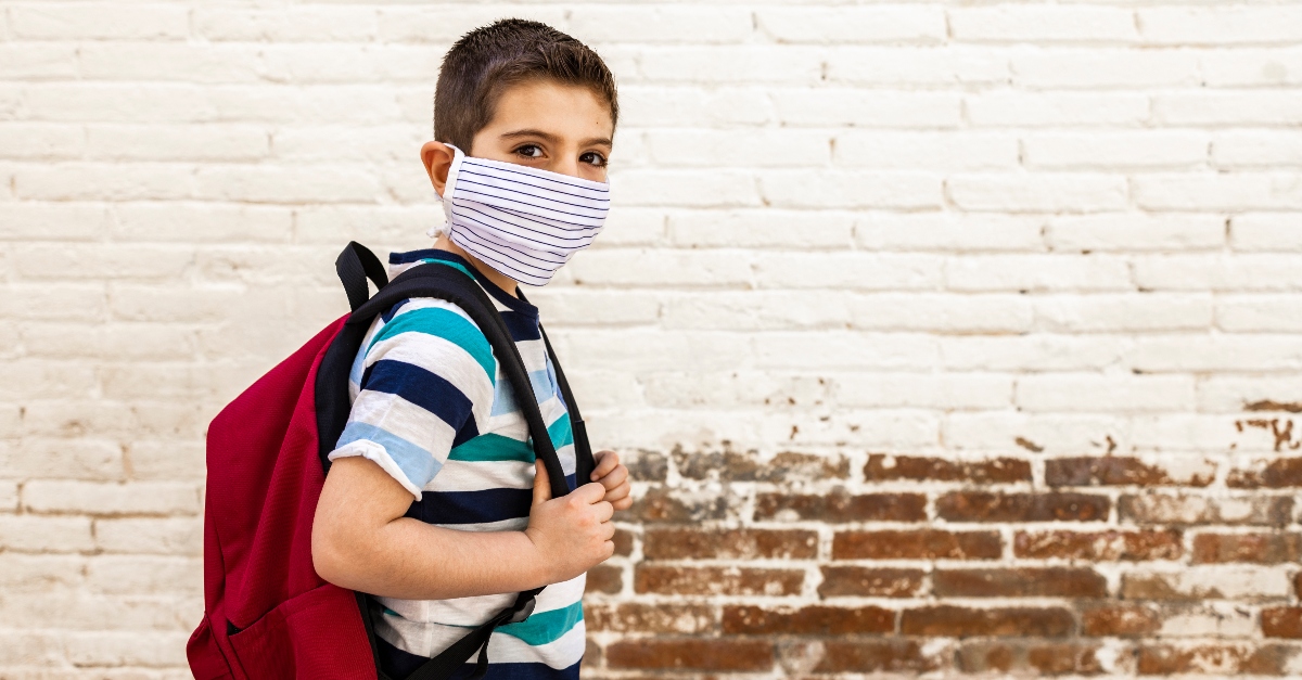 young boy student wearing mask going to school, praying armor of god over returning students